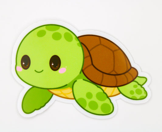 A die-cut sticker featuring a cute cartoon sea turtle with a bright green head and flippers, a brown shell, and a yellow underside, shown on a plain white background.