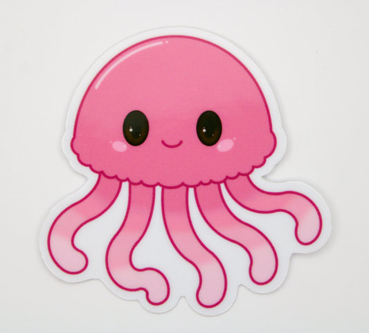 A cute pink cartoon jellyfish sticker with large black eyes and a smiling mouth, shown on a plain light background.